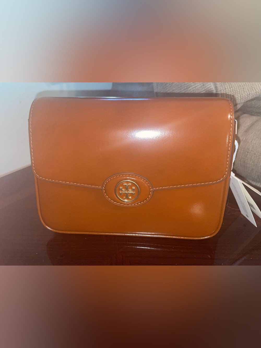 Tory Burch Two-Tone Leather Clutch in Tan and White with Logo Medallion